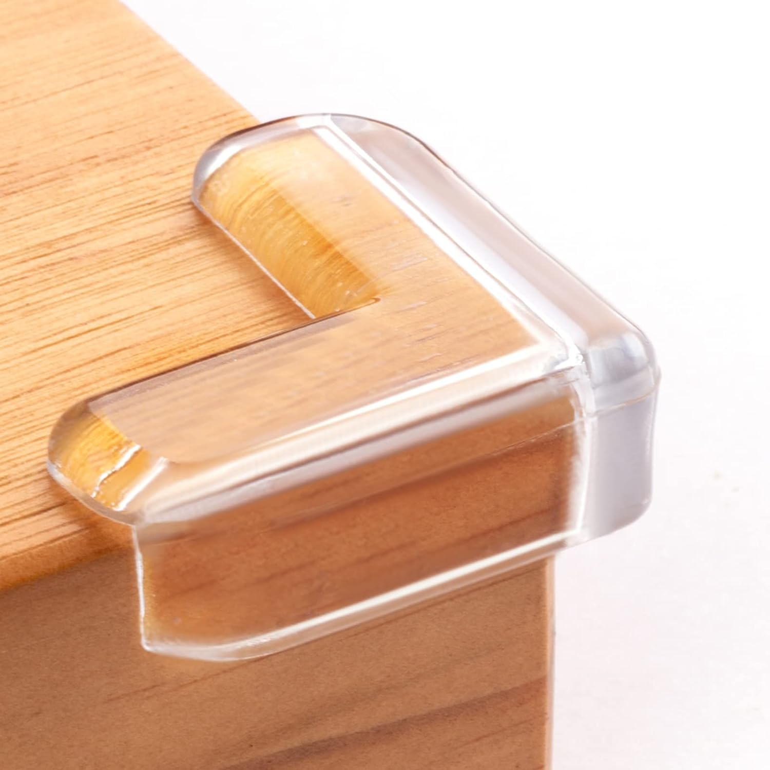 8 Pack Corner Protector for Baby, Clear Corner Protectors,Corner Guard: A grandmother's hands pressing a clear silicone