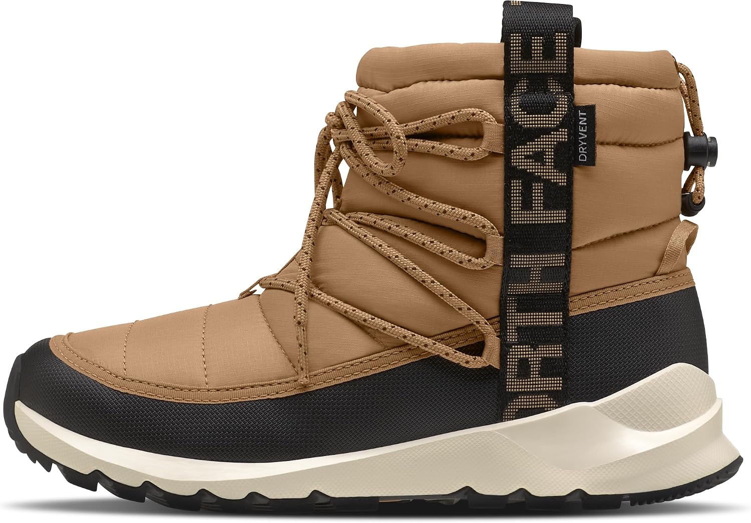The North Face womens Thermoball Traction Bootie: Woman in jeans stepping through fresh snow wearing black quilted North